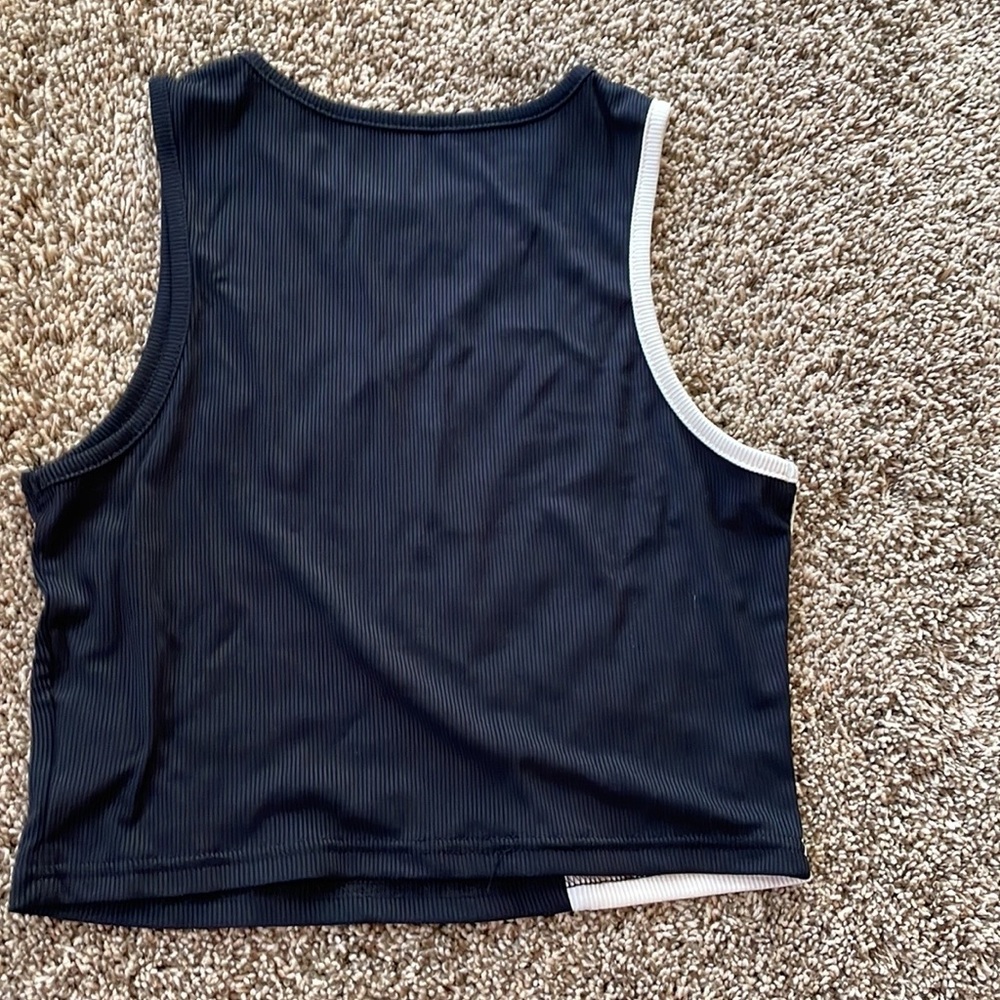 NEW size large but runs more like medium, and a body suit size small. Lot of 4 - Picture 9 of 9